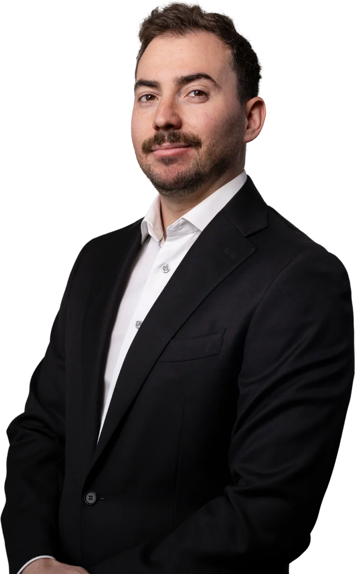 Michael Gloria, Calgary REALTOR®, in a dark suit and white shirt